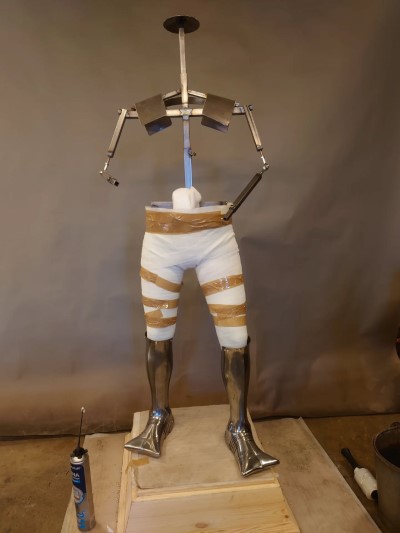 armor stand made of steel pipe and fittings.